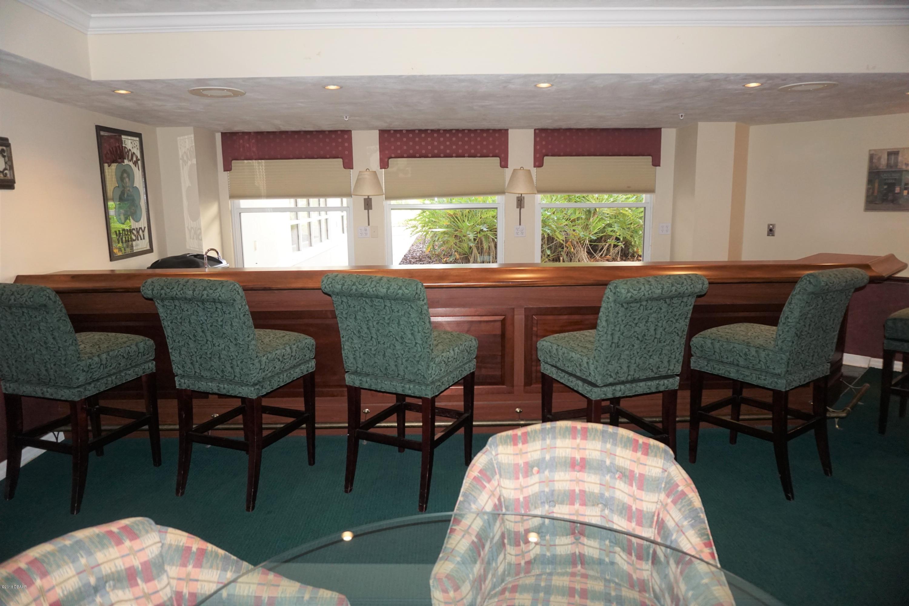 1 John Anderson Drive, Unit 113 Ormond Beach, FL 32176 - Photo 64 of 76 a living room with furniture and a window