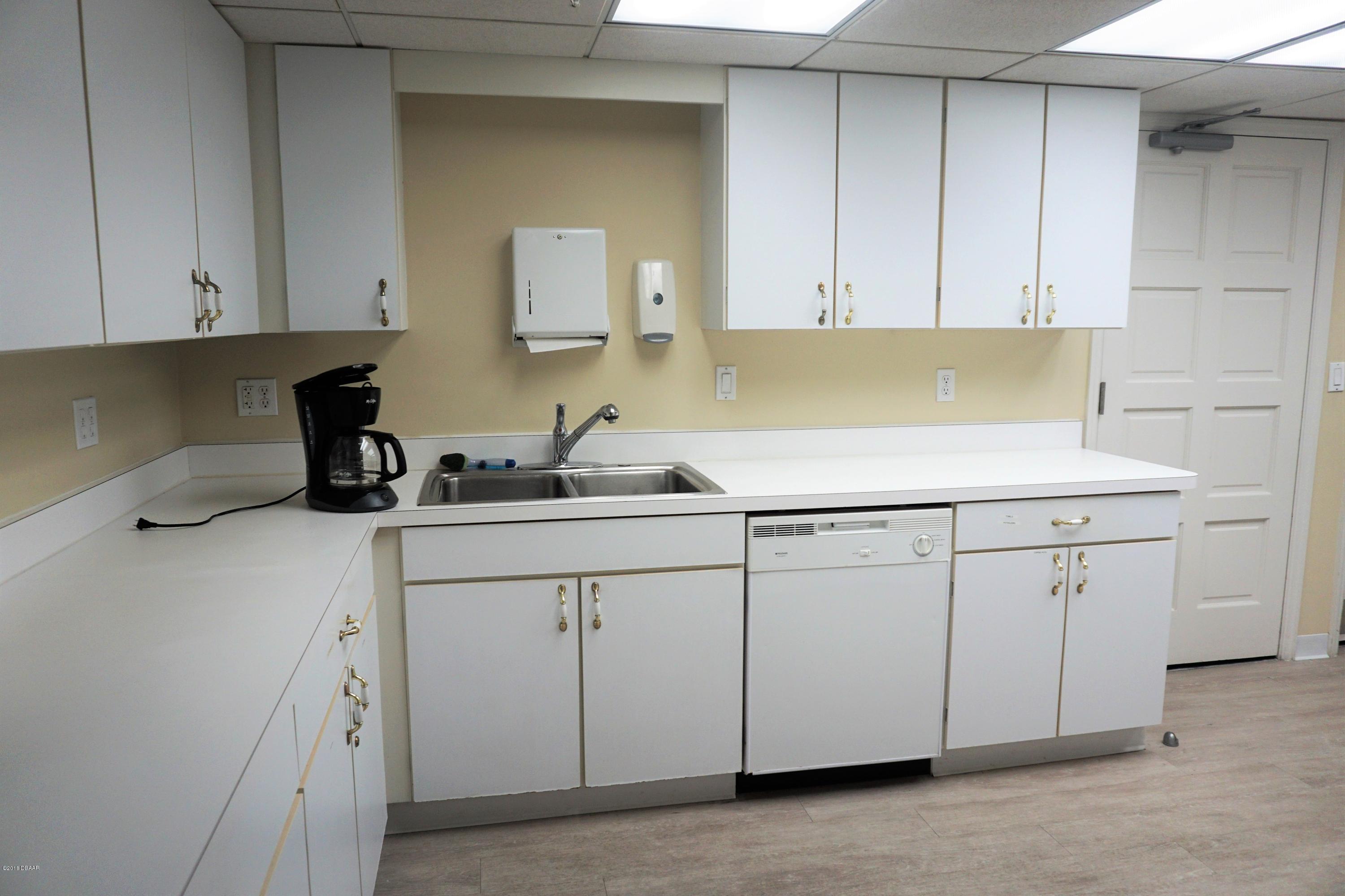 1 John Anderson Drive, Unit 113 Ormond Beach, FL 32176 - Photo 65 of 76 Full kitchen off ballroom