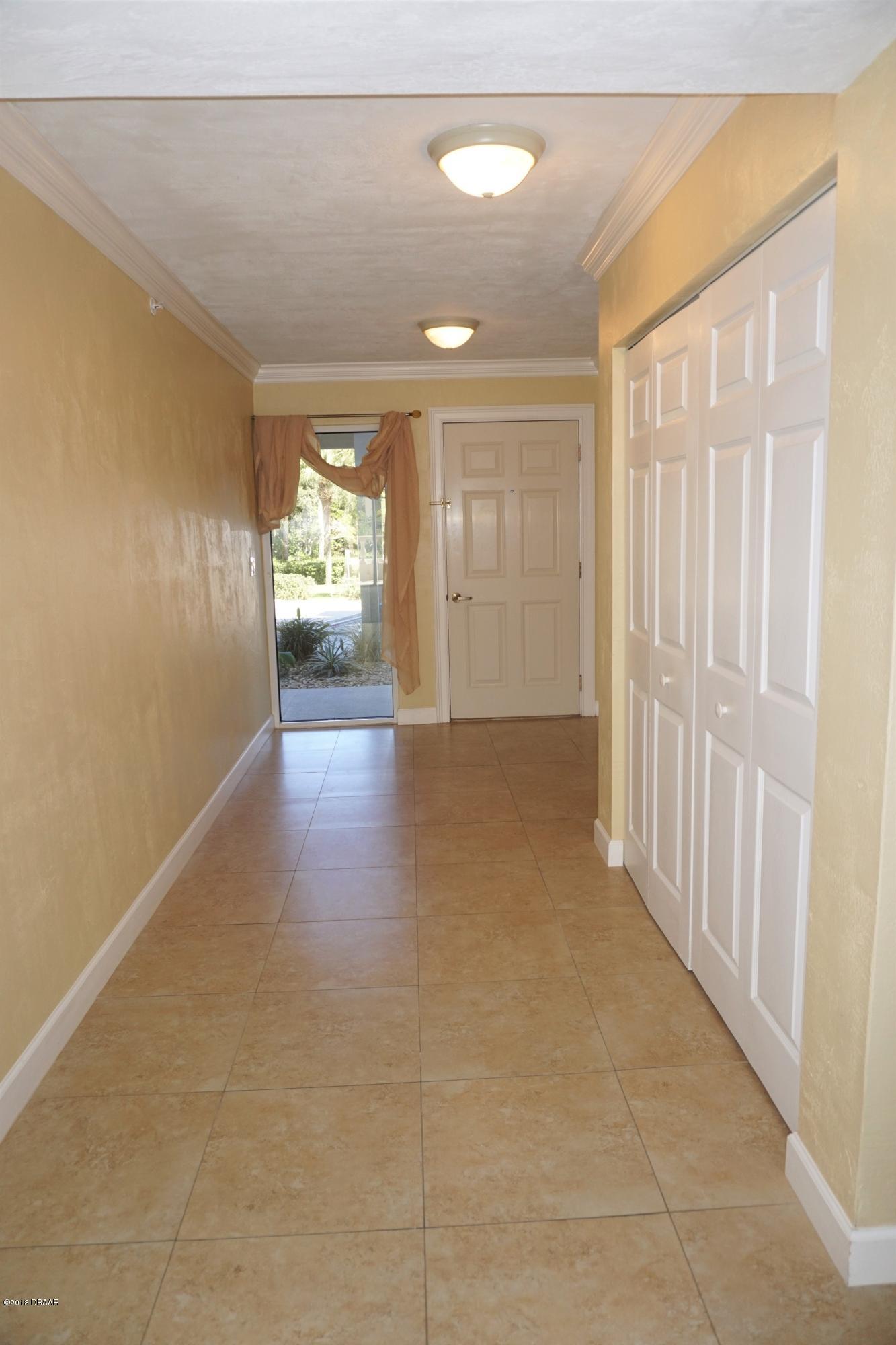 1 John Anderson Drive, Unit 113 Ormond Beach, FL 32176 - Photo 7 of 76 a view of gallery with wooden floor