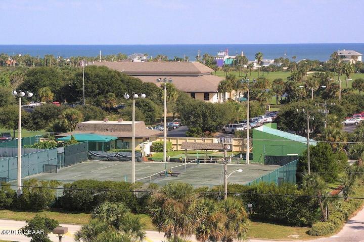 1 John Anderson Drive, Unit 113 Ormond Beach, FL 32176 - Photo 75 of 76 an aerial view of a house with a yard and lake view