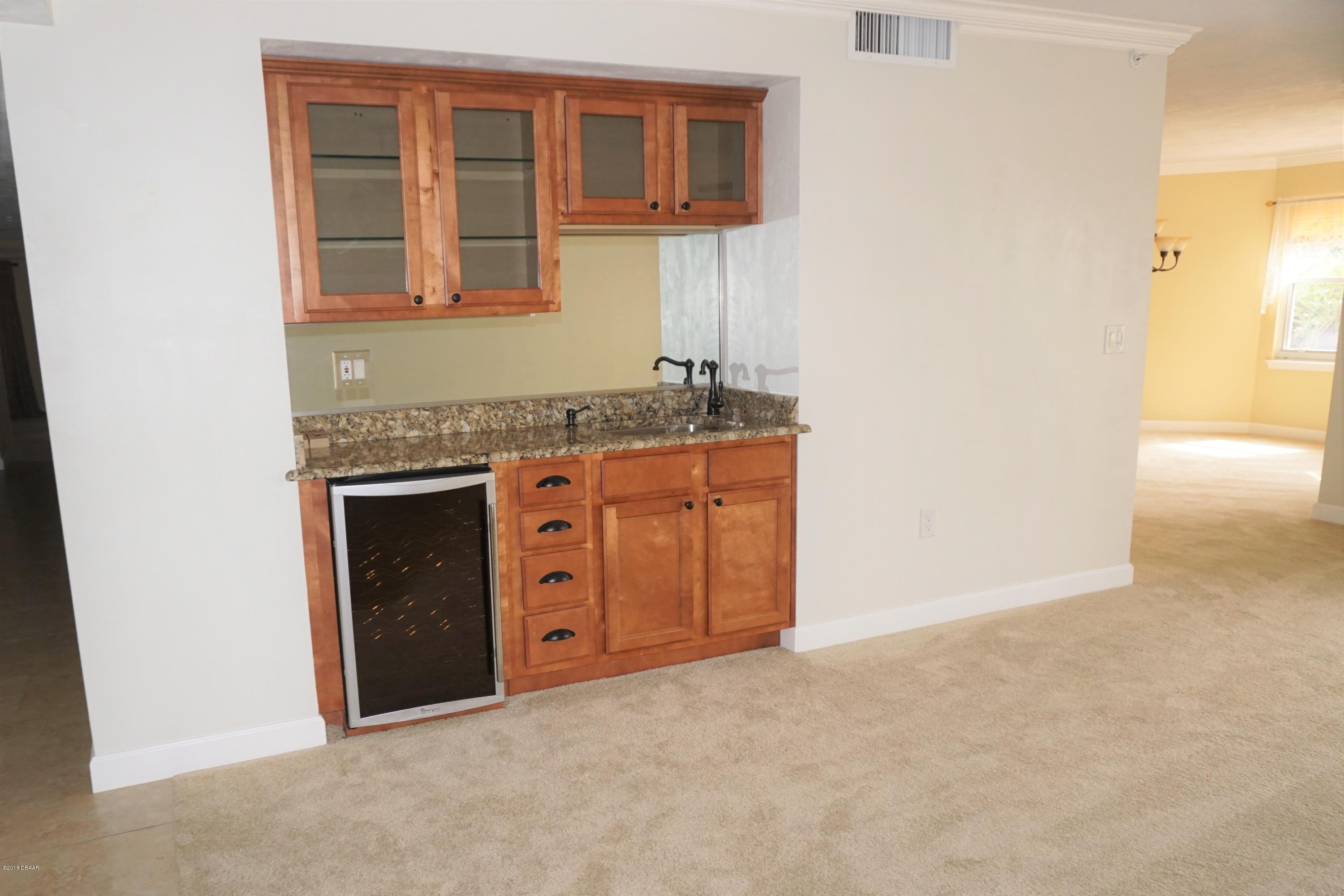 1 John Anderson Drive, Unit 113 Ormond Beach, FL 32176 - Photo 8 of 76 Wet bar in LR