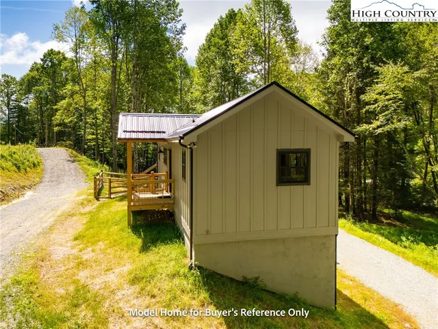 a view of a backyard with swimming pool