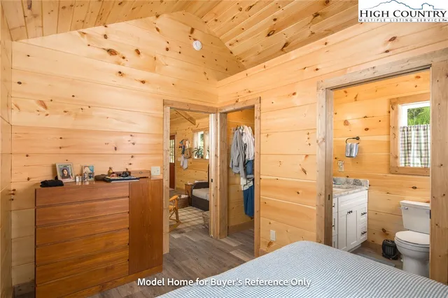 a bathroom with a toilet sink shower and mirror