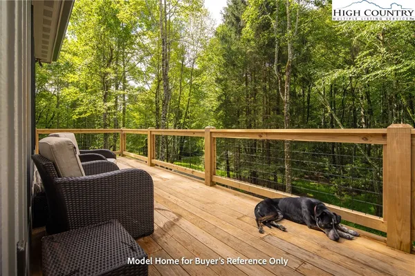 a view of a chair and tables in the balcony