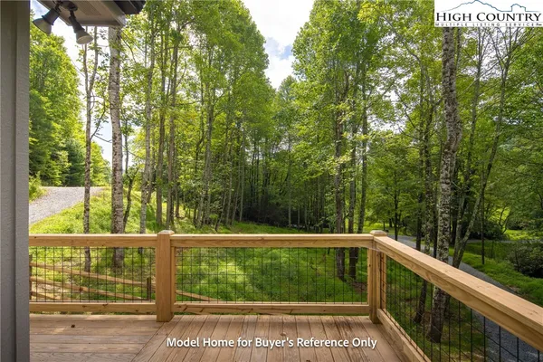 a view of balcony with yard