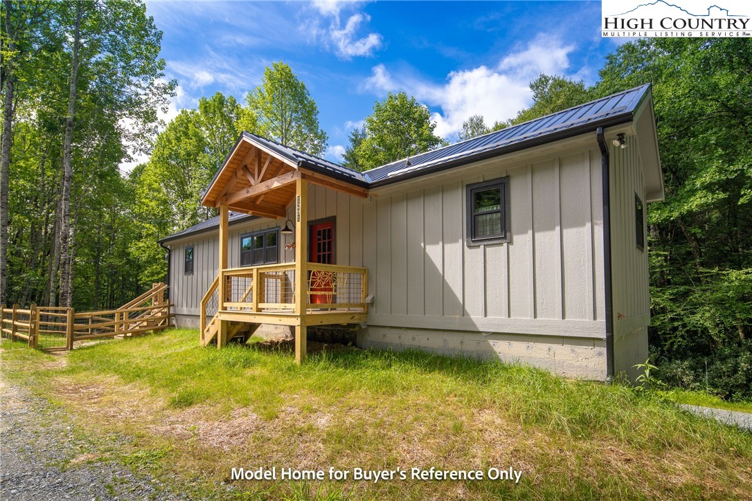 490 Laurelwood Lane Boone, NC 28607 - Photo 27 of 50 a front view of a house with garden
