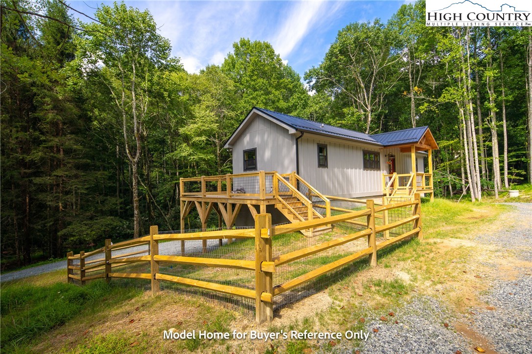 490 Laurelwood Lane Boone, NC 28607 - Photo 28 of 50 a view of a house with backyard and sitting area