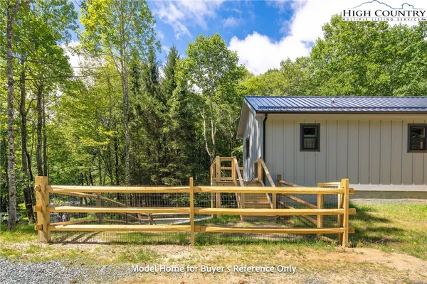 a view of house with swimming pool