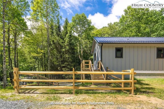 a view of house with swimming pool