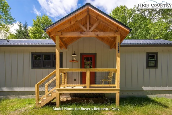 a view of a house with a small yard
