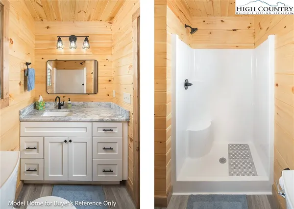 a bathroom with a granite countertop sink a mirror and a shower
