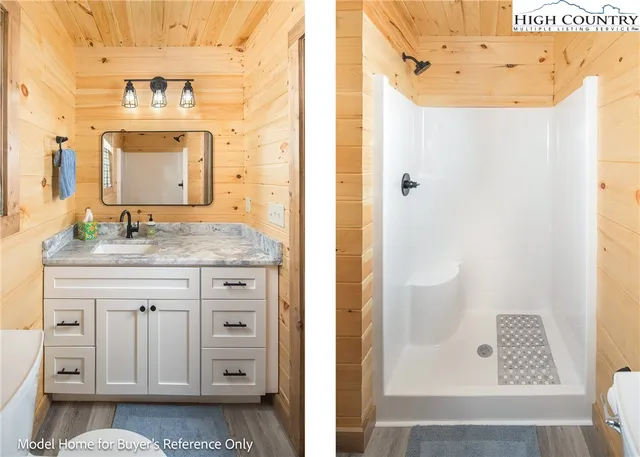 a bathroom with a granite countertop sink a mirror and a shower