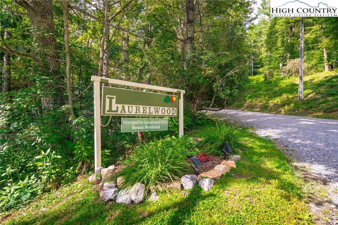 490 Laurelwood Lane Boone, NC 28607 - Photo 50 of 50 a sign that is sitting in the middle of a forest
