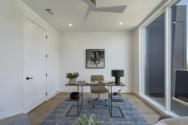 a workspace with furniture and a window