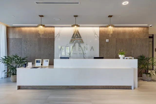 a white bath tub sitting in a bathroom