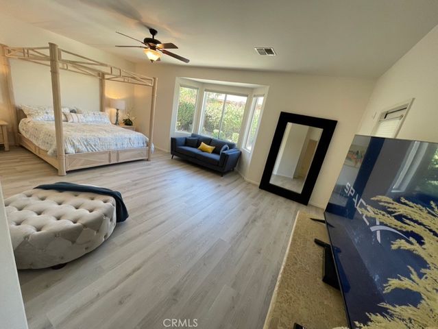 a bedroom with bed and window