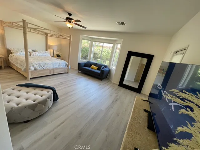 a bedroom with bed and window