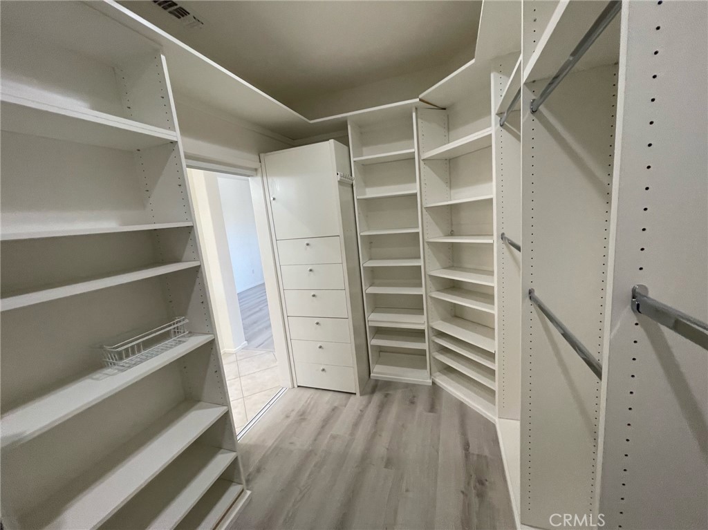 35330 Rosemont Drive Palm Desert, CA 92211 - Photo 14 of 38 a view of walk in closet with empty racks
