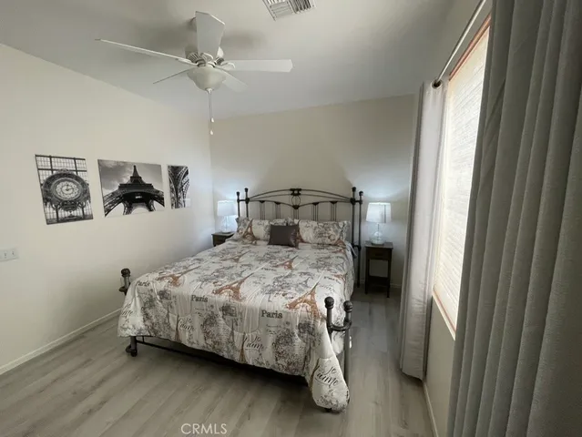 a bedroom with a bed and a table