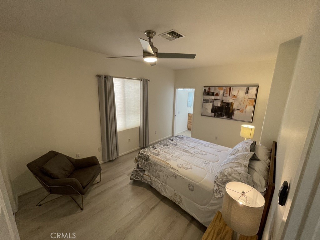 35330 Rosemont Drive Palm Desert, CA 92211 - Photo 18 of 38 a bed room with a bed and a chair
