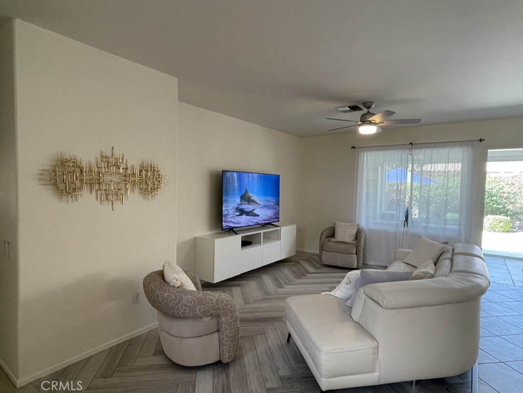 35330 Rosemont Drive Palm Desert, CA 92211 - Photo 2 of 38 a living room with furniture and a large window