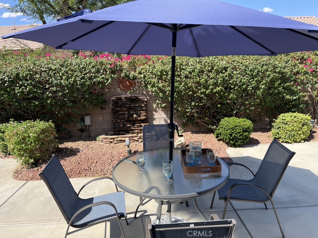 35330 Rosemont Drive Palm Desert, CA 92211 - Photo 22 of 38 a patio with a patio table and chairs