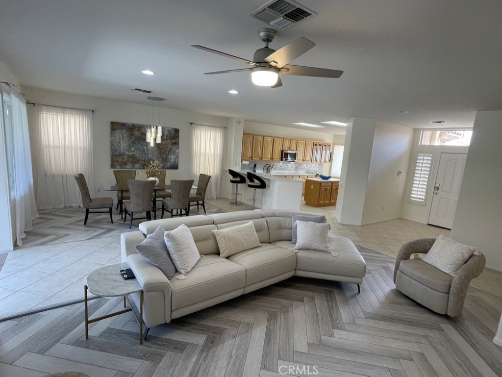 35330 Rosemont Drive Palm Desert, CA 92211 - Photo 3 of 38 a living room with furniture and a wooden floor