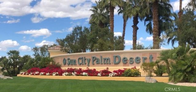 a front view of a building with a garden