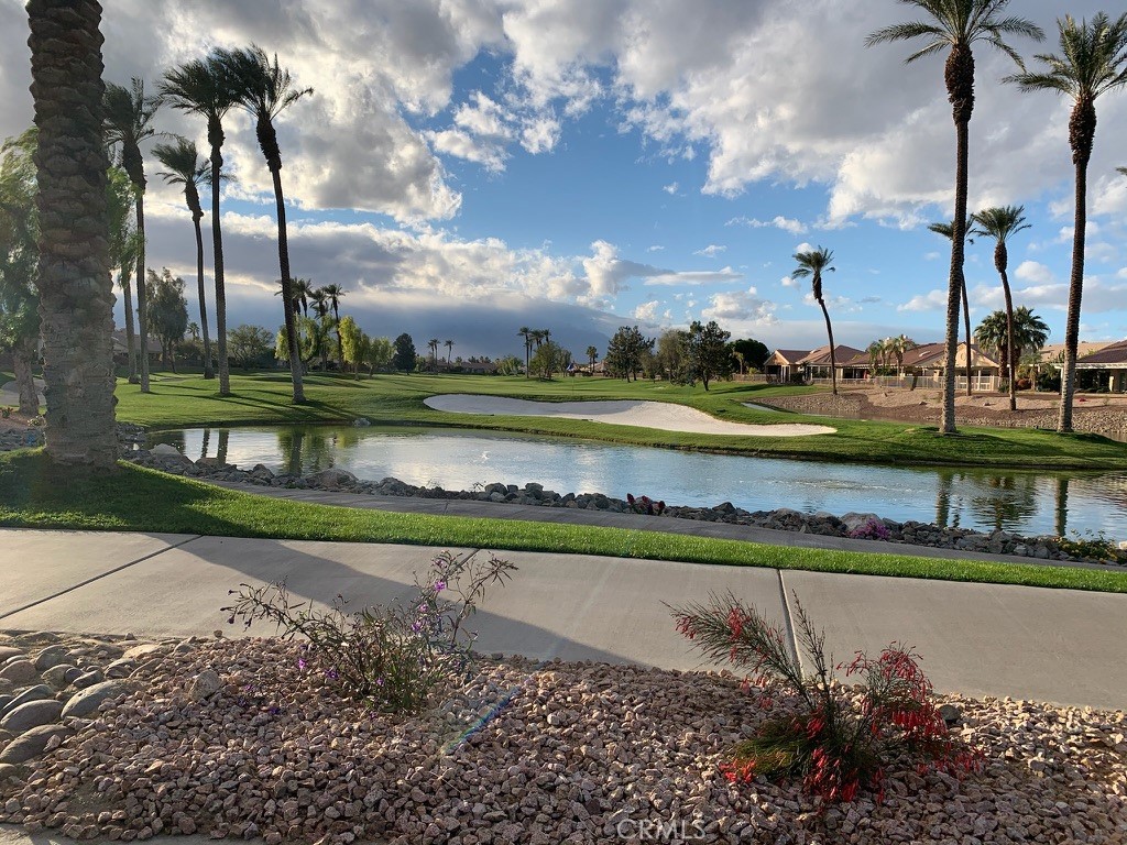 35330 Rosemont Drive Palm Desert, CA 92211 - Photo 34 of 38 a view of a lake with a big yard