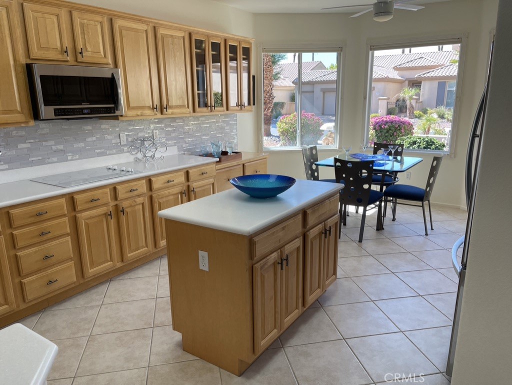35330 Rosemont Drive Palm Desert, CA 92211 - Photo 6 of 38 a kitchen that has a cabinets and a stove top oven