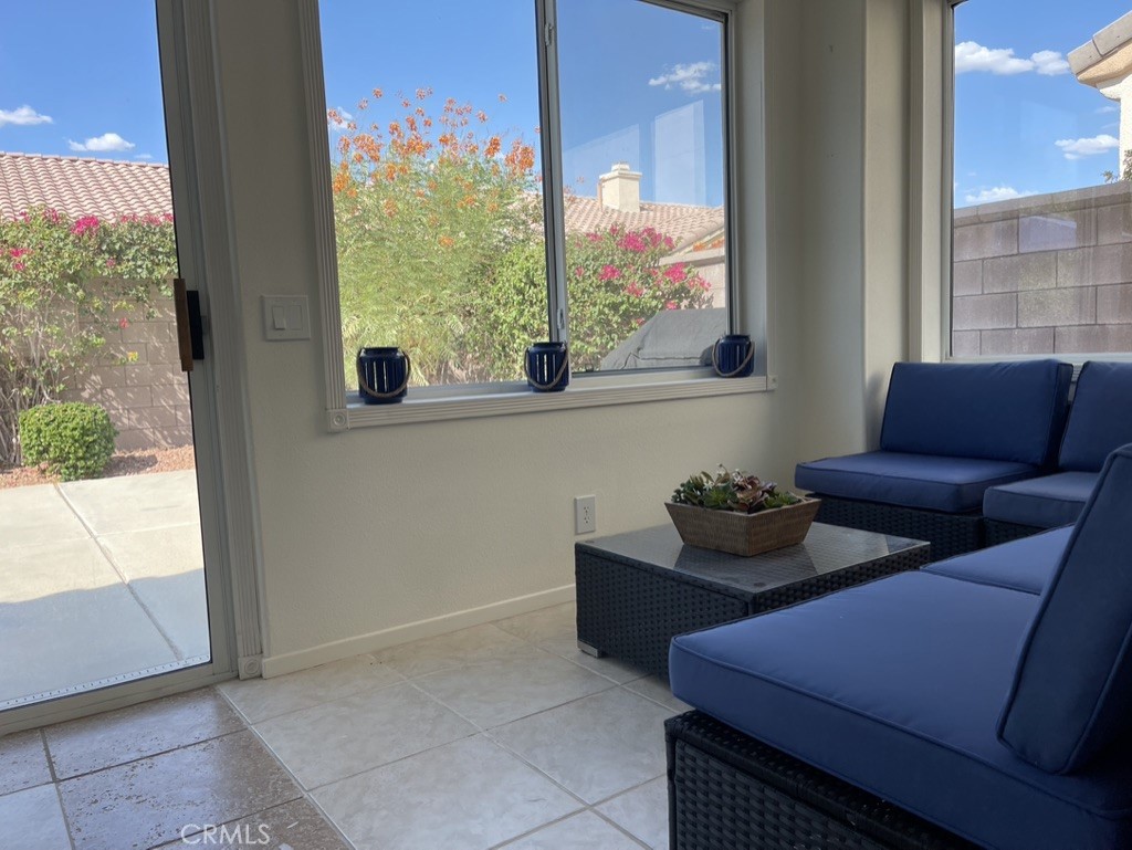35330 Rosemont Drive Palm Desert, CA 92211 - Photo 8 of 38 a living room with furniture and a large window