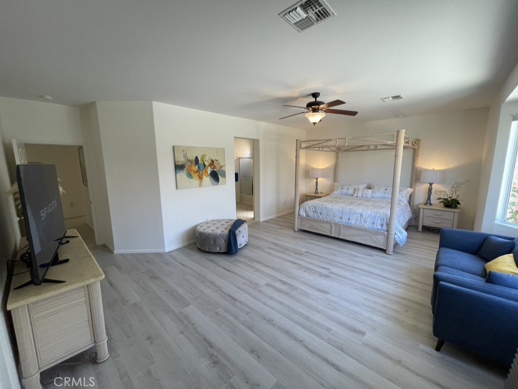 35330 Rosemont Drive Palm Desert, CA 92211 - Photo 9 of 38 a living room with furniture and a flat screen tv