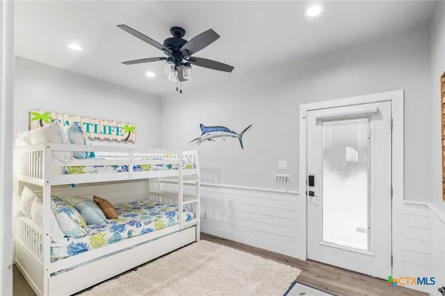 a bathroom with a granite countertop sink toilet a mirror and shower