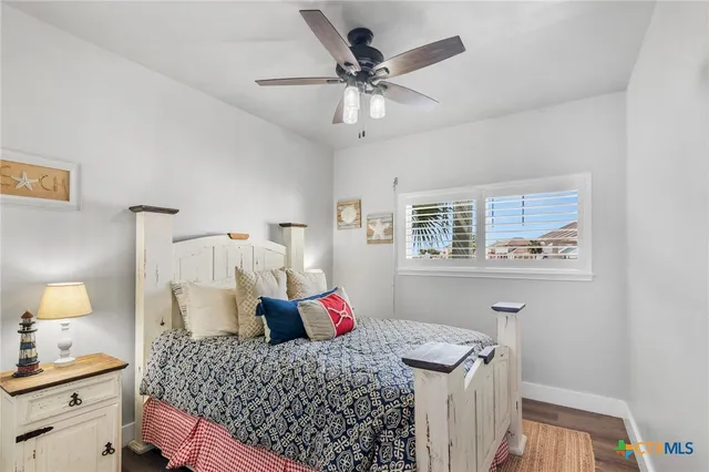 a bedroom with a large bed and a flat screen tv