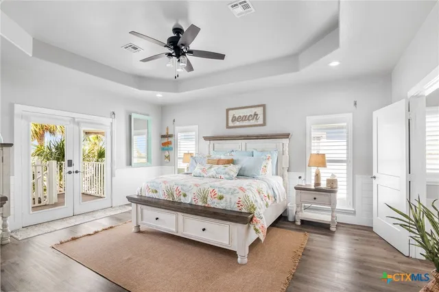 a bathroom with a granite countertop sink toilet and mirror