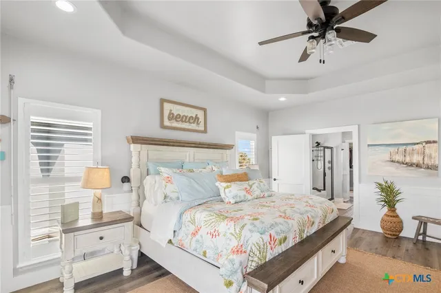 a bedroom with furniture and a window