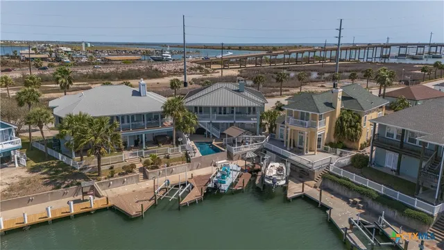 an aerial view of a house with balcony and outdoor space