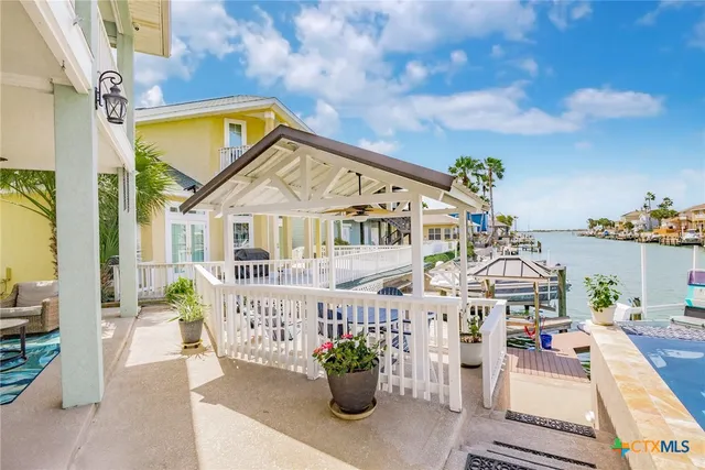 a view of a balcony with two chairs and a table