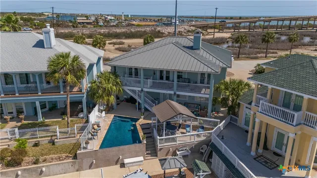 an aerial view of a city with ocean view