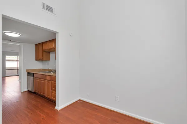 a view of a kitchen with a sink and a stove