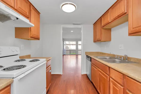 a bathroom with a sink mirror and toilet