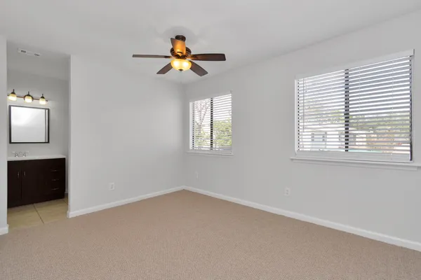 a view of a room with wooden floor and window