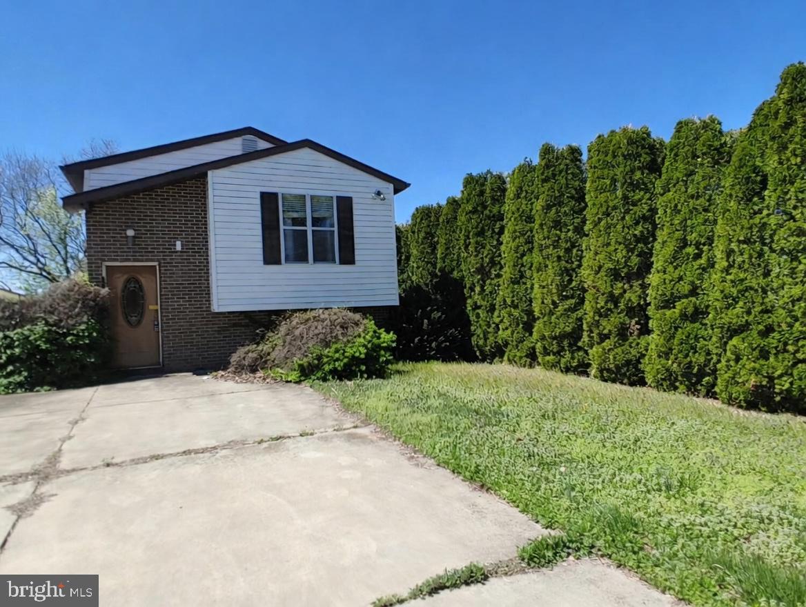 Charming home with lush greenery.