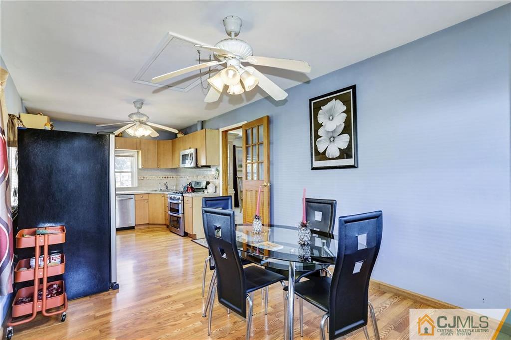 35 Clemson Road Old Bridge, NJ 08859 - Photo 15 of 25 a view of a dining room with furniture and wooden floor