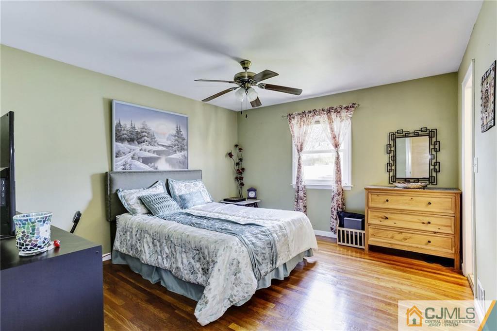 35 Clemson Road Old Bridge, NJ 08859 - Photo 16 of 25 a bedroom with a bed and wooden floor
