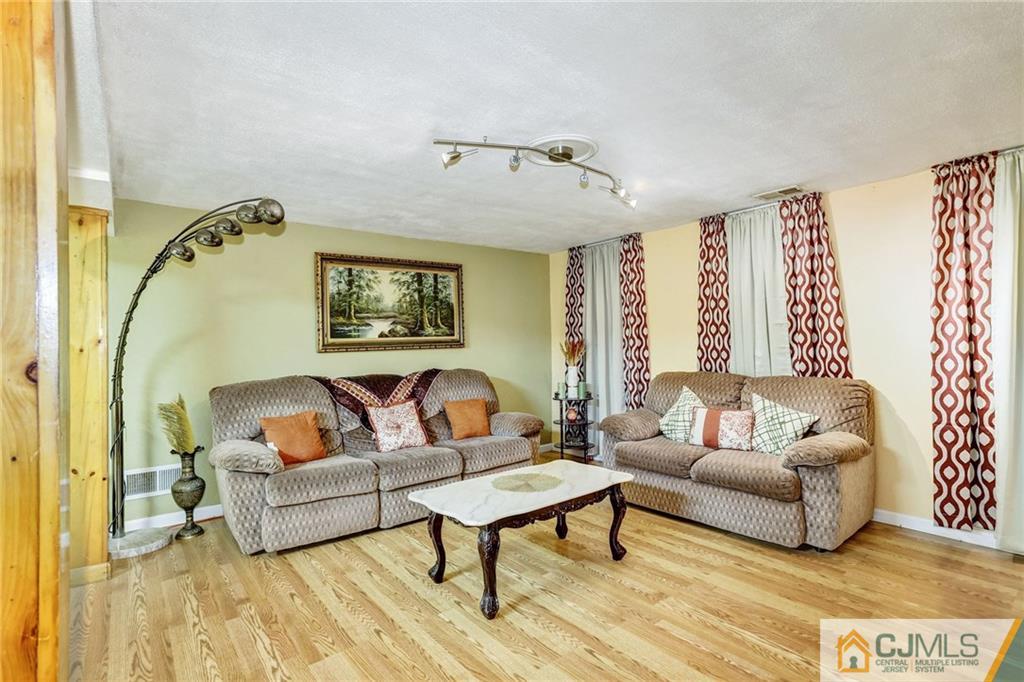 35 Clemson Road Old Bridge, NJ 08859 - Photo 20 of 25 a living room with furniture and a rug