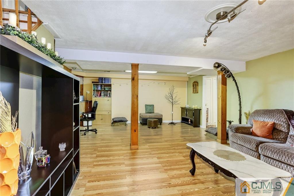 35 Clemson Road Old Bridge, NJ 08859 - Photo 21 of 25 a living room with furniture and a flat screen tv