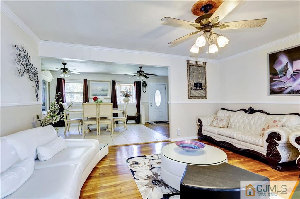 35 Clemson Road Old Bridge, NJ 08859 - Photo 6 of 25 a living room with furniture and a chandelier