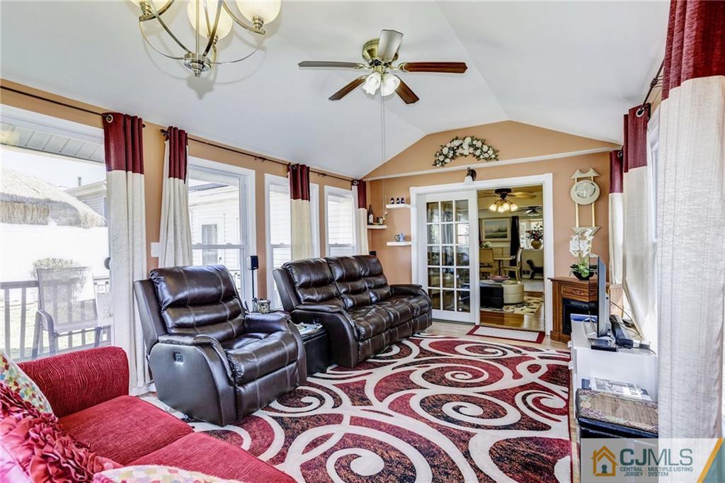 35 Clemson Road Old Bridge, NJ 08859 - Photo 9 of 25 a living room with furniture ceiling fan and a window