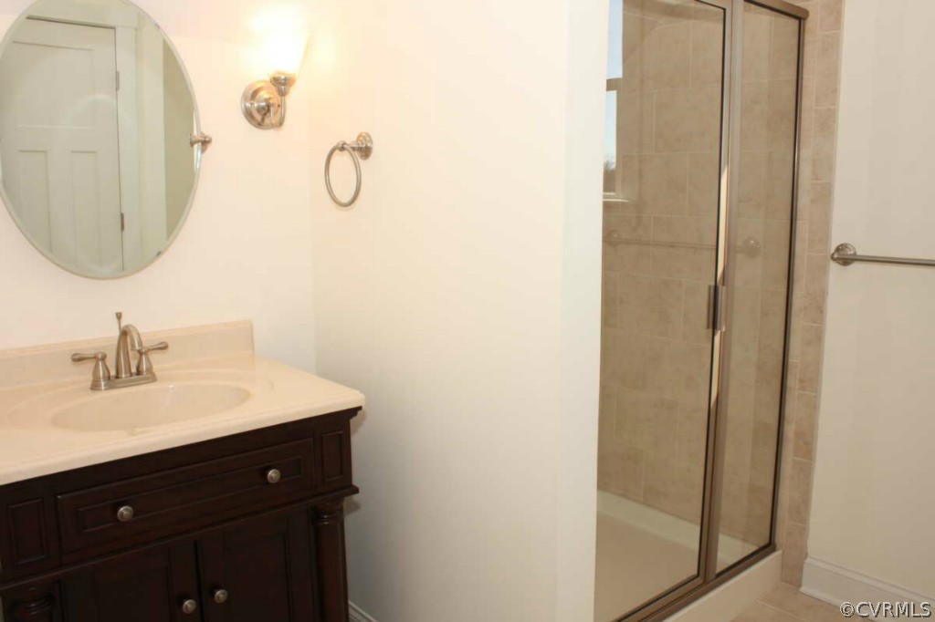 3324 Handley Road Midlothian, VA 23113 - Photo 16 of 24 a bathroom with a sink vanity and a mirror